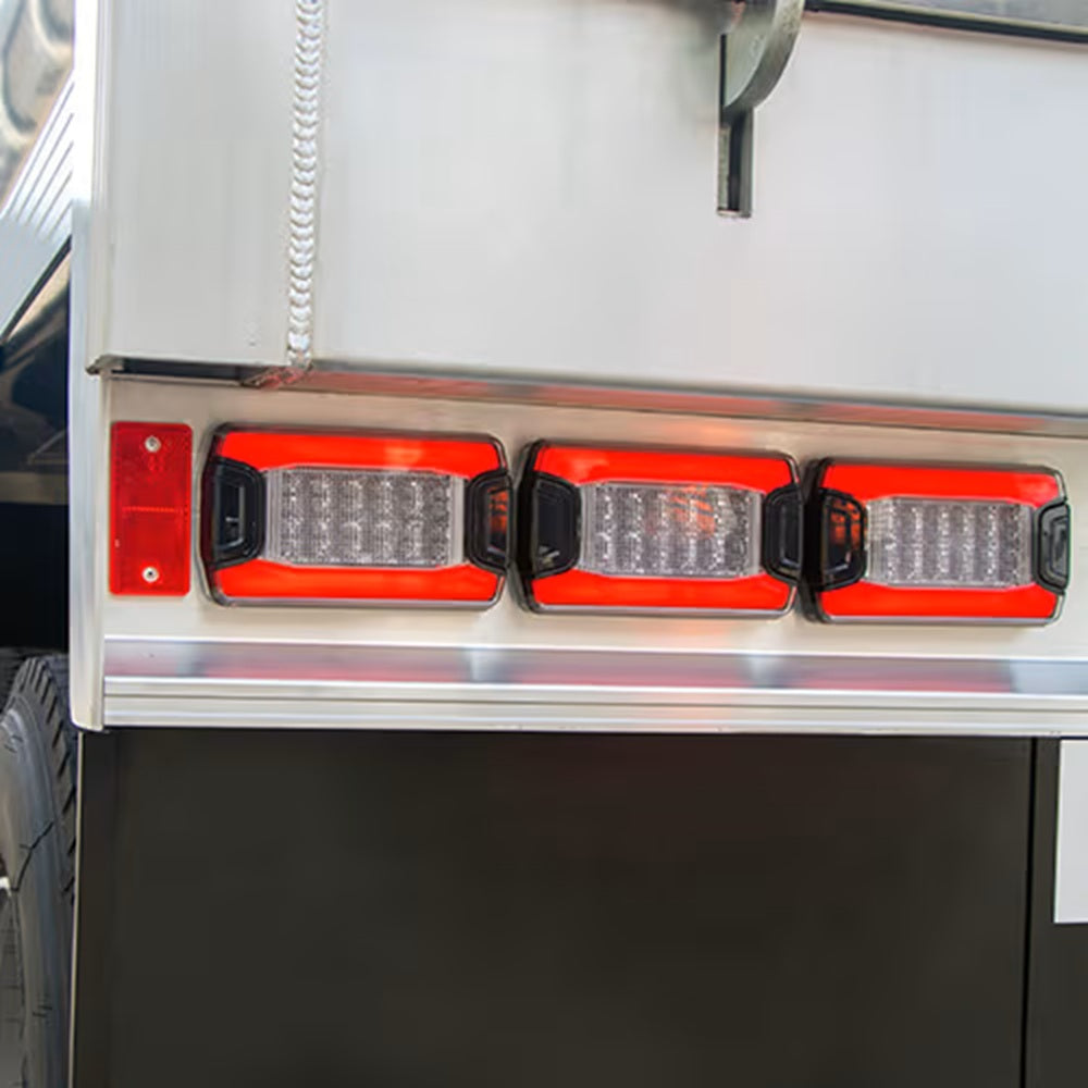 2ZR 350 300-071 Hella DuraLED PRIME Reversing Lamp-Close-up of red LED tail lights on a vehicle.