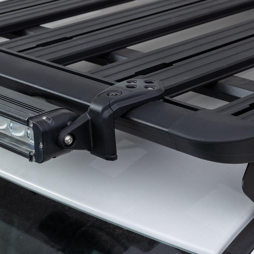 Rhino-Rack Stow It Light Bar Adaptor - 2 Pack-ISIR. Front view of black adaptor attaching a lightbar to a roof rack.